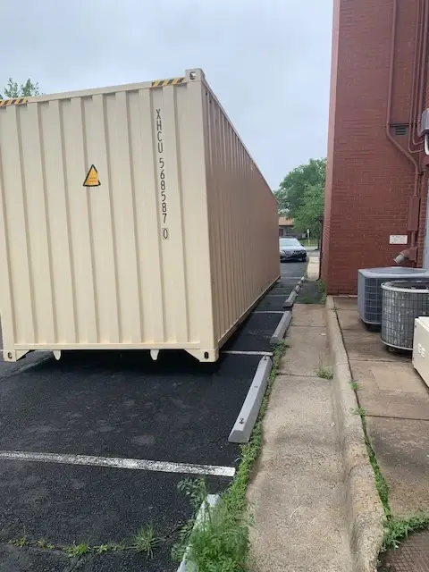 40ft high cube shipping container being carefully unloaded in Baltimore