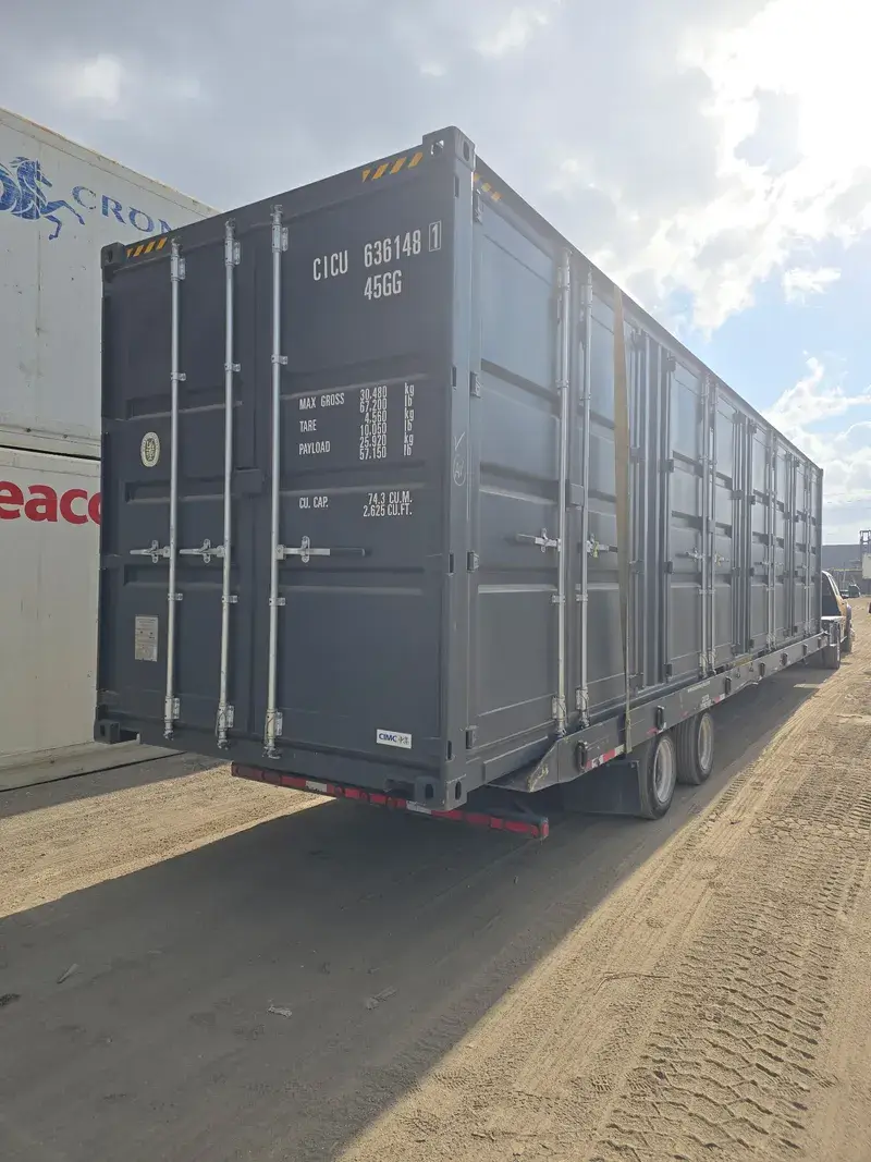 40'ft High Cube Open Side Container on a tilt-bed trailer