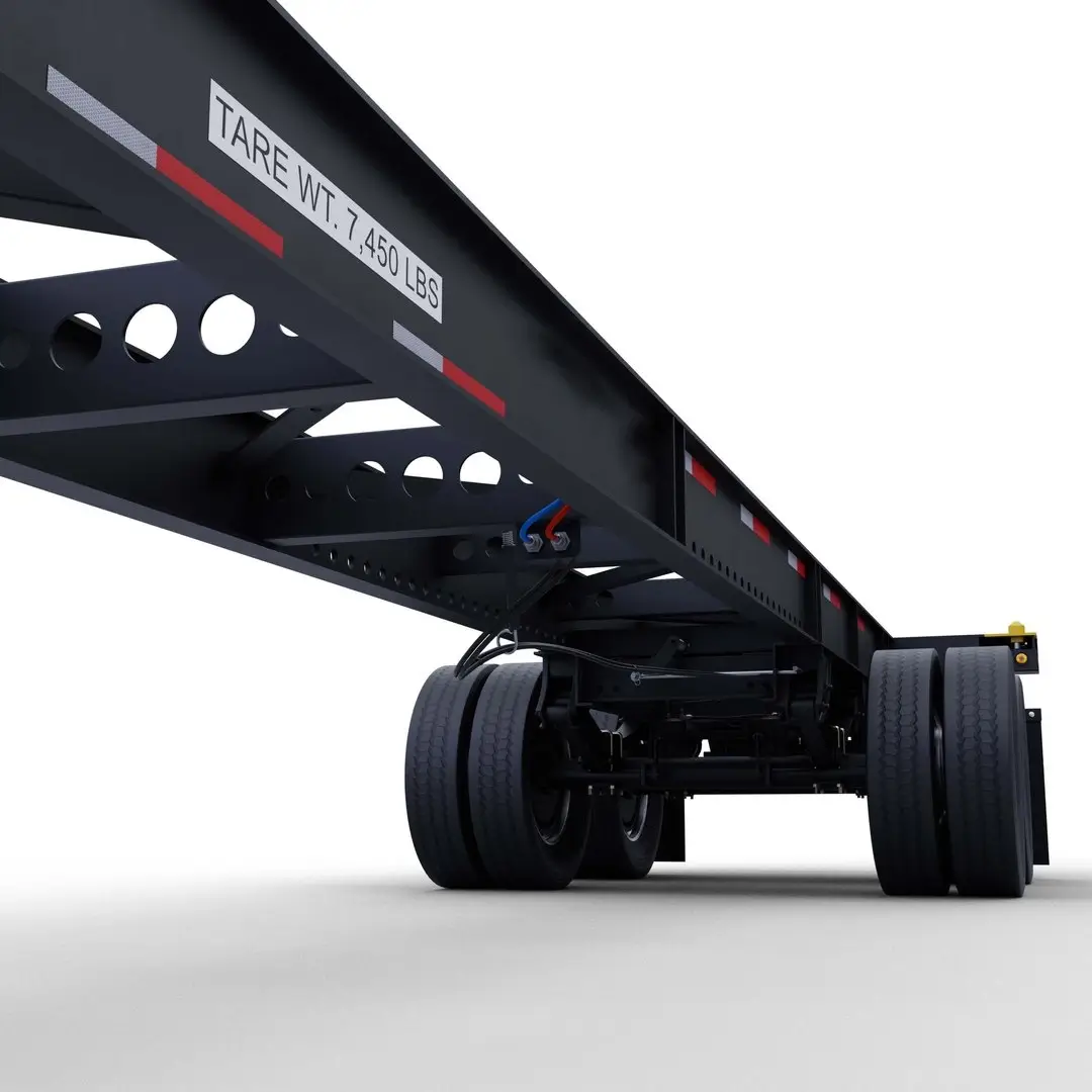 Underneath view of a 53ft gooseneck tandem chassis showing suspension and axles